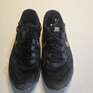 Nike Black Athletic Running Shoes with Gold Swoosh